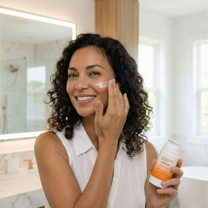 Woman applying skincare product in a bathroom setting